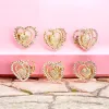 Set 12 Clești de Păr Metalici Aurii în Formă de Inimă Decorați cu Pietre Transparente