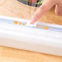 Dispenser multifuncțional pentru folie alimentară cu sistem de tăiere integrat