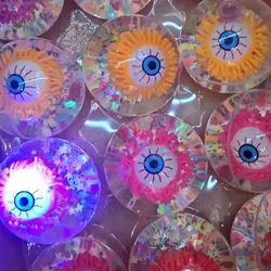 Set 12 Mingi Săritoare cu Lumini LED, Design "Ochi cu Sclipici" și Interior cu Lichid, 6.5 cm