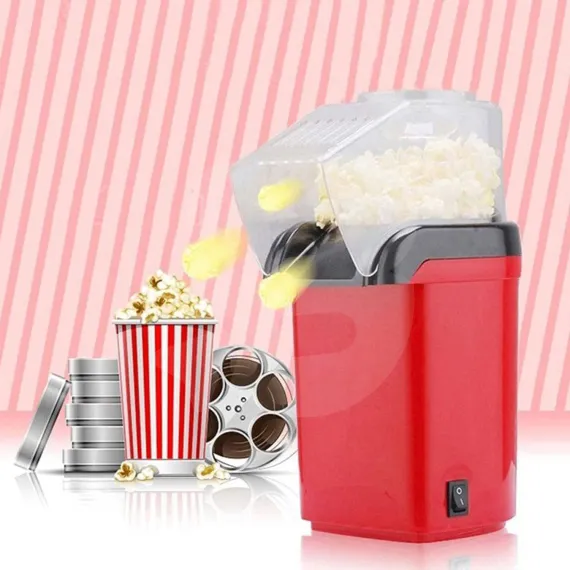 Mini mașină de popcorn în funcțiune cu floricele de porumb