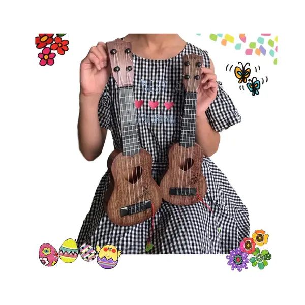 Copil ținând chitară Classic pentru copii 4 corzi